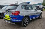 =BMW X5 des THW OV MEMMINGEN steht auf dem Parkplatzgelände der RettMobil 2024 in Fulda