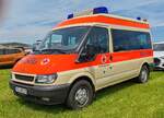 =Ford Transit 90T350 vom BRK FELDKIRCHEN steht im Mai auf dem Besucherparkplatz der RettMobil 2024