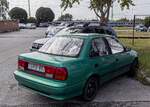 Rückansicht: Suzuki Swift Mk2 Facelift Stufenheck (Farbe: True Green).