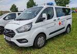 =Ford Transit Custom des DRK OV RHEINE steht im Mai 2024 auf dem Besucherparkplatz der RettMobil in Fulda