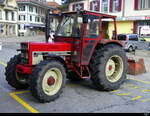 Roter International Harvester 733vor dem Bhf- Langnau an 19.02.2025