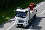 Ein MB Actros von Baumat auf dem Weg zum Trucker Festival am 28.6.24 auf der A8 in Matten b.